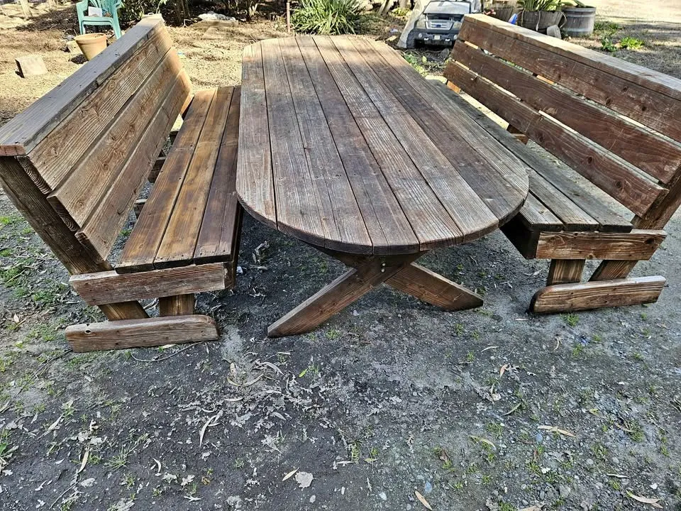 Weathered Wood Oval Picnic Table with Attached Benches